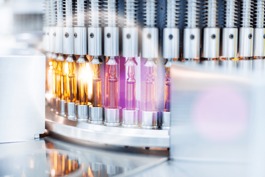 Vials of colorful liquid inside test tubes on a centerfuge